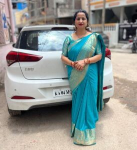 a woman in saree standing image